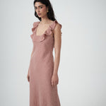 Mood shot featuring the Solan check bias  Ruffle Maxi Dress