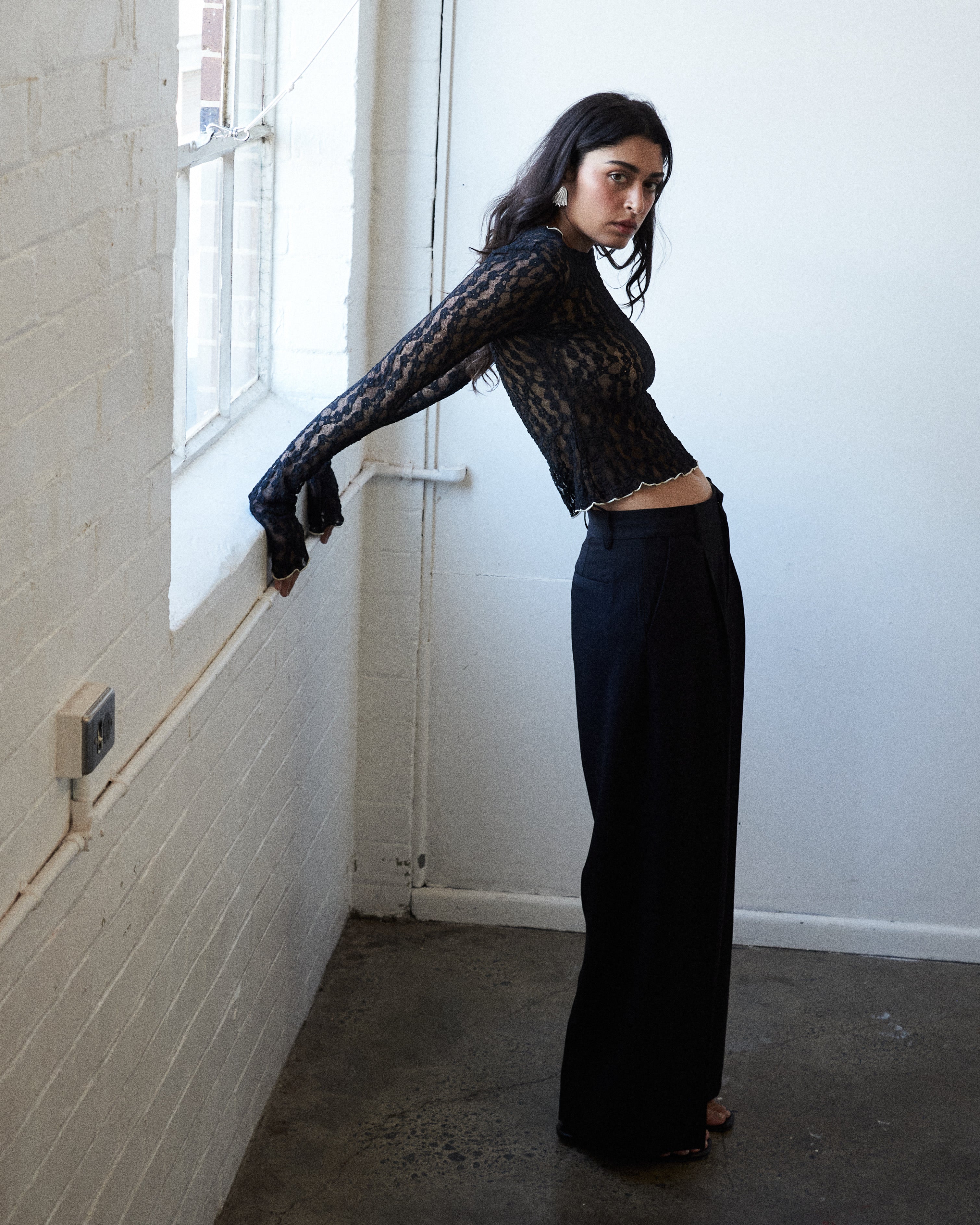 Black floral lace designer top by VARNA styled for day-to-night elegance.