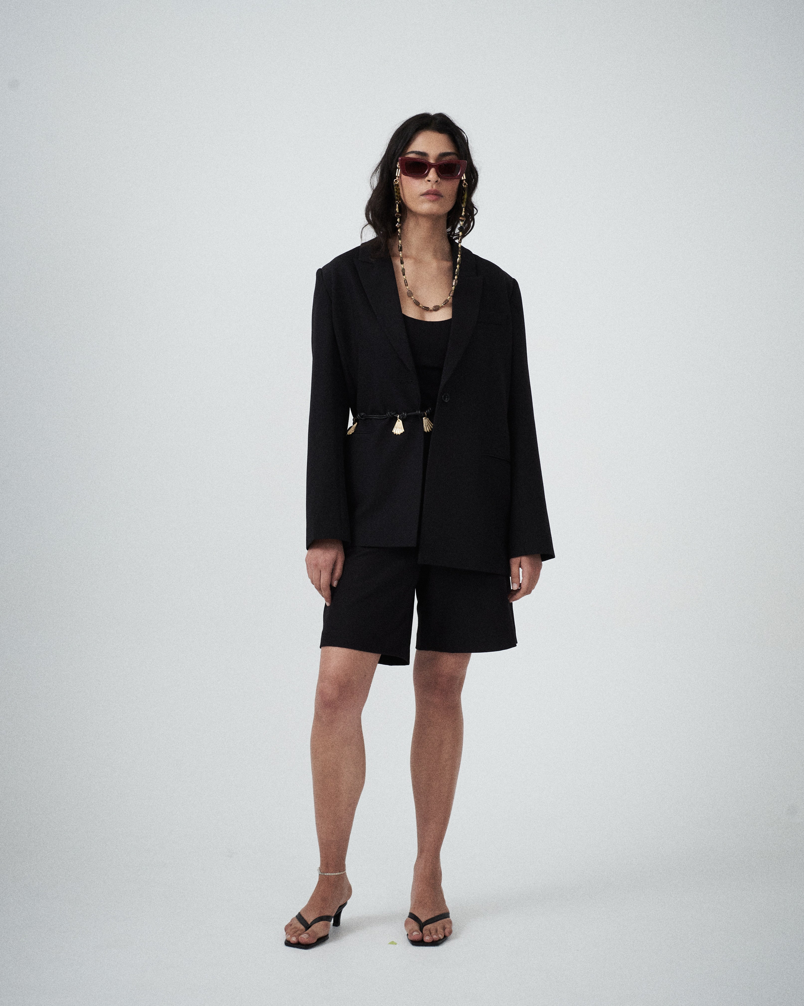 Editorial mood image of the VARNA Erica Oversized Blazer in black — designer relaxed tailoring with an effortless, modern silhouette.