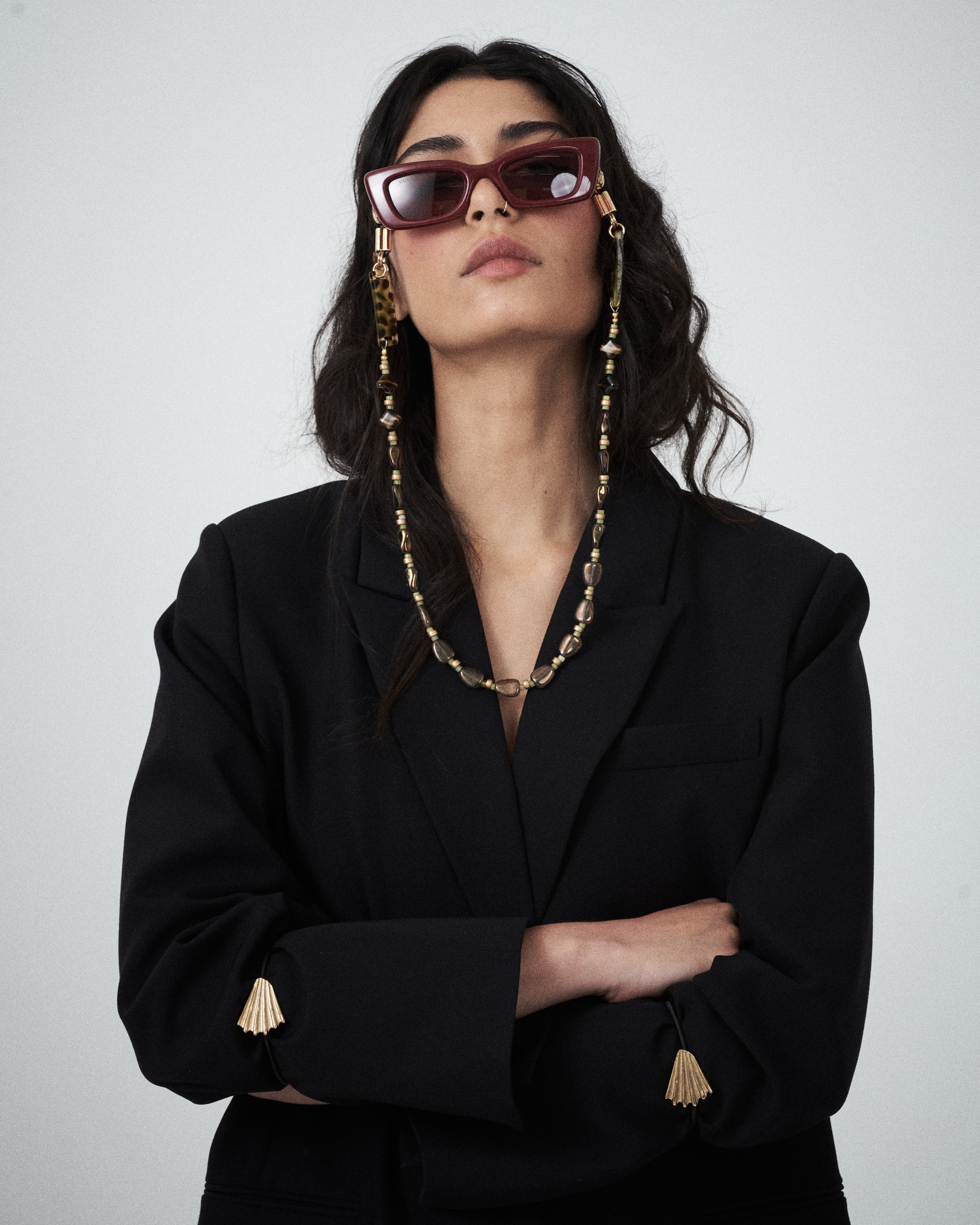 Editorial close-up of the VARNA Erica Oversized Blazer in black showing tonal button detailing and minimalist tailoring.