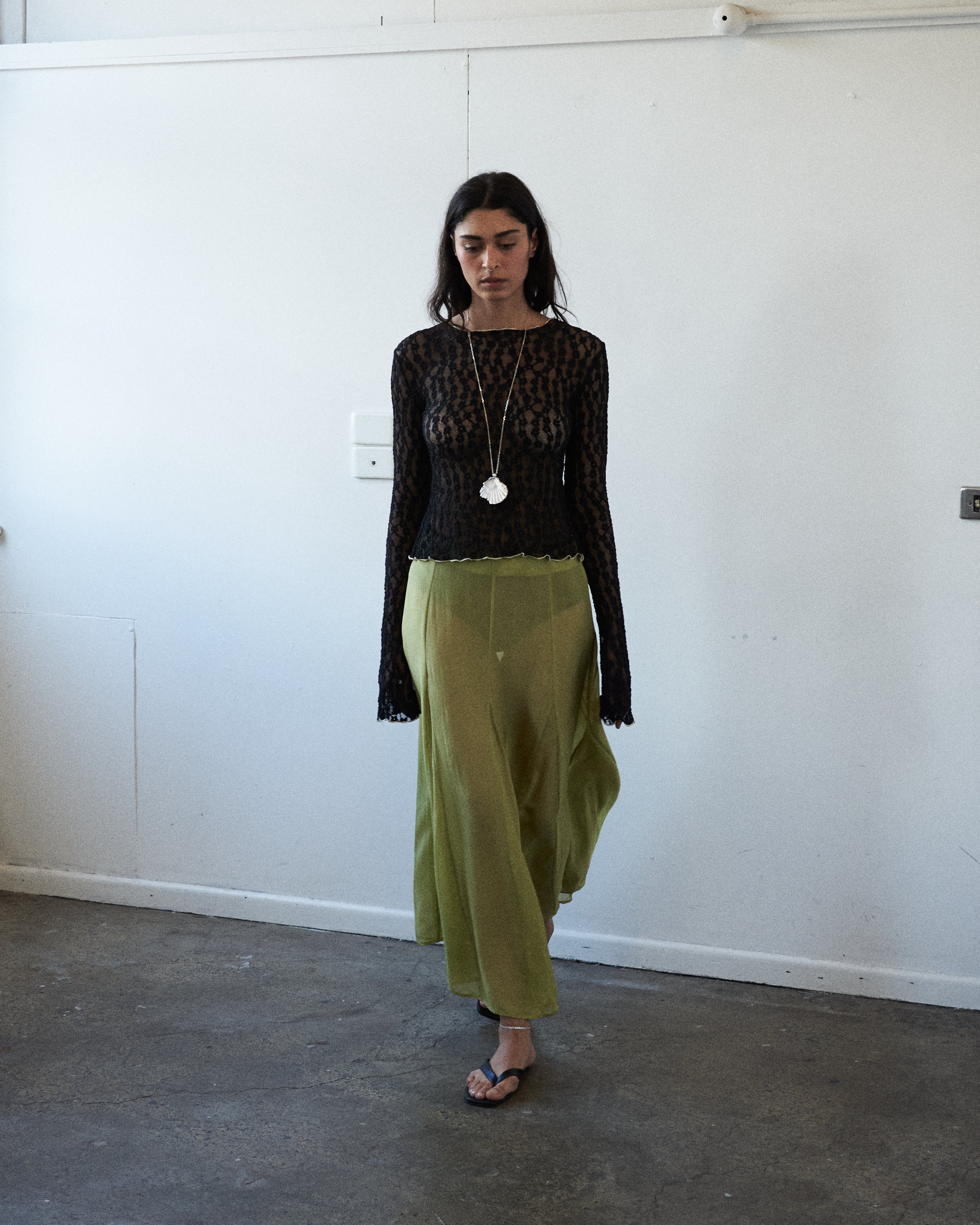 Editorial front view of the VARNA Arden Full Maxi Skirt in pear silk — designer high-waisted skirt with full, fluid silhouette.