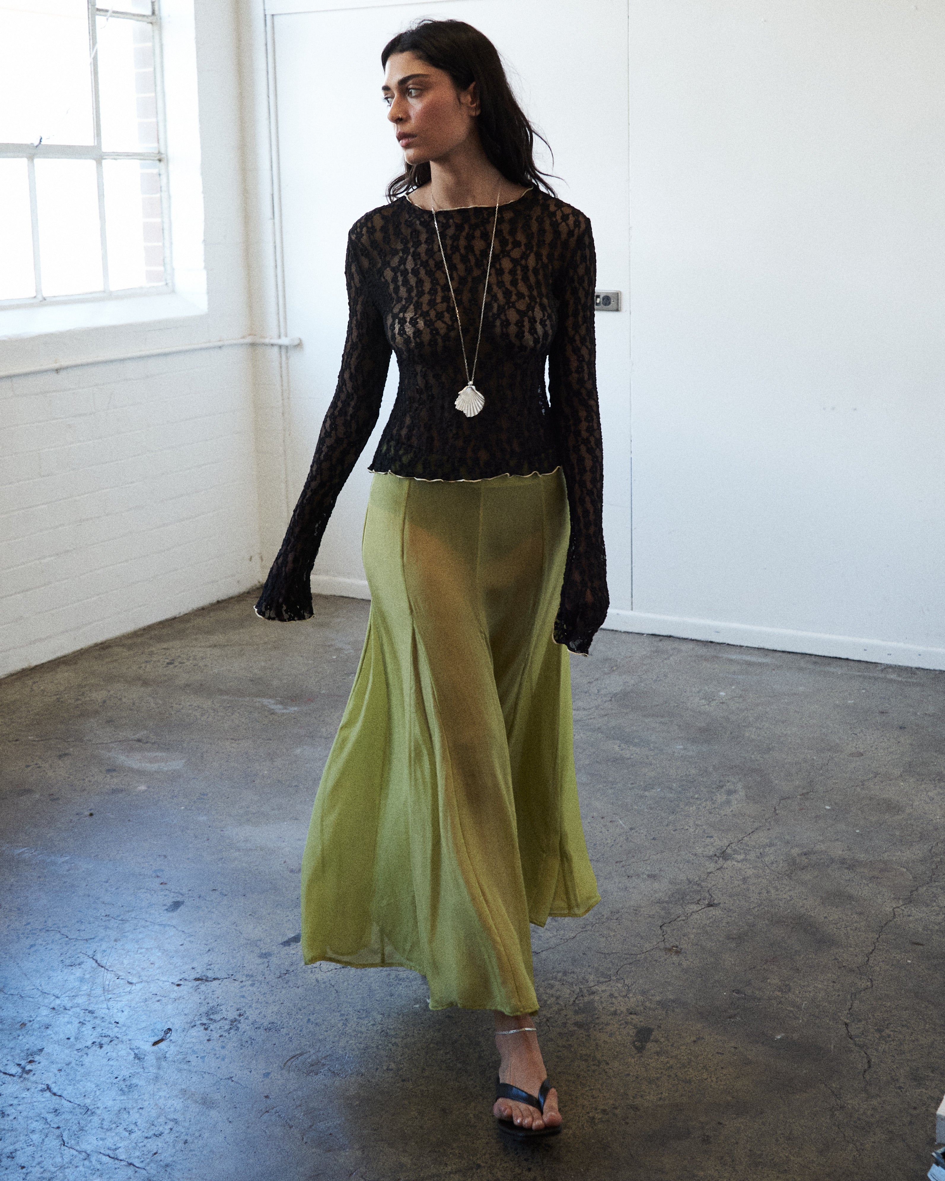 Second editorial front image of VARNA Arden Full Maxi Skirt in pear — 100% silk skirt with elegant volume and refined sheen.