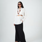 Designer white cotton shirt by VARNA with statement cut-outs and side ties.