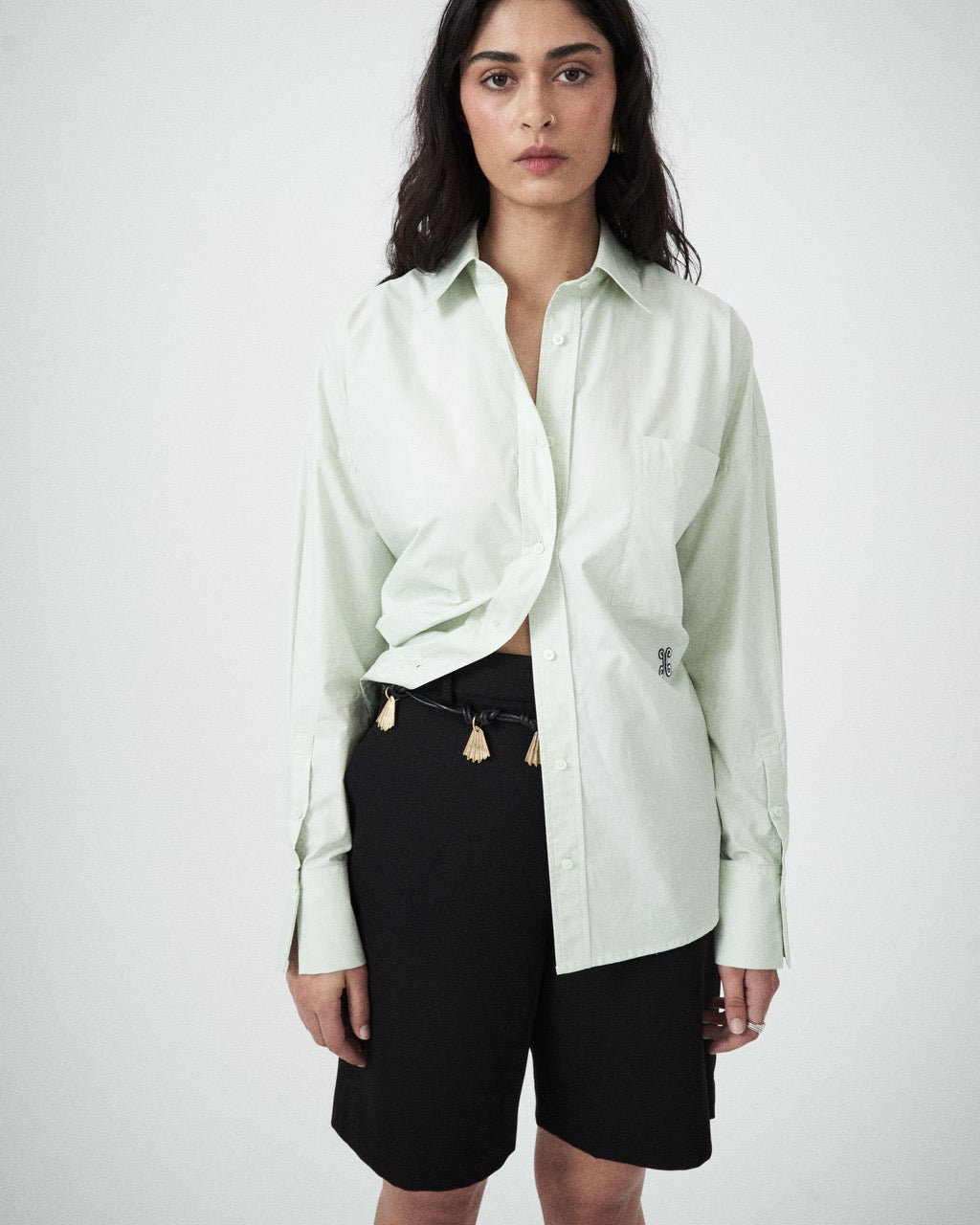 Close-up detail showing collar, cuffs, or embroidery of the Elara Shirt