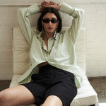 Mood shot featuring the Elara Shirt in Pistachio