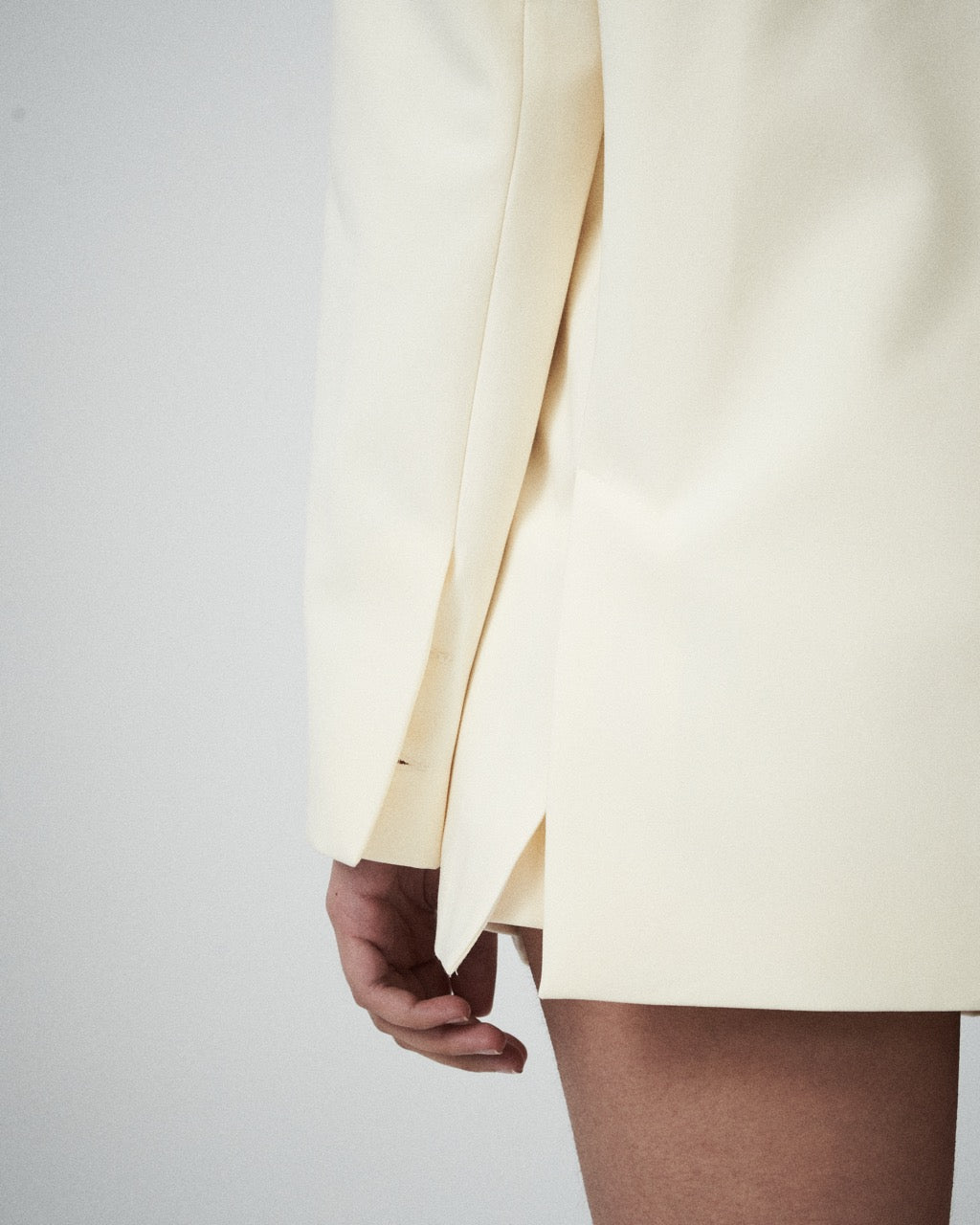 Close-up of details of milk blazer