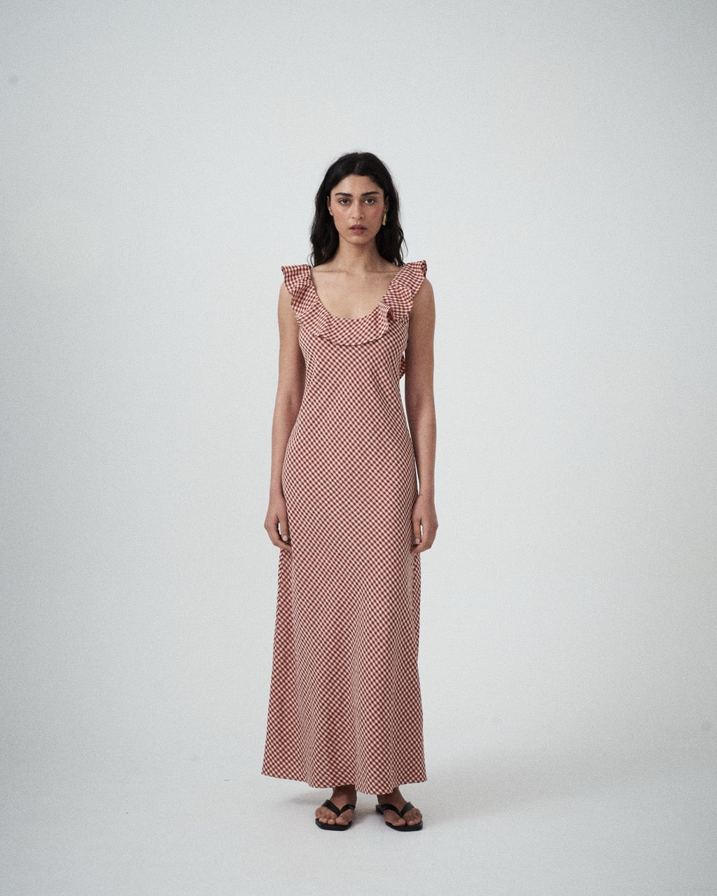 Front view of model wearing the Solan check bias Ruffle Maxi Dress
