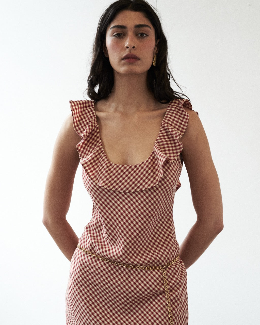 Mood shot featuring the Solan check bias Ruffle Maxi Dress