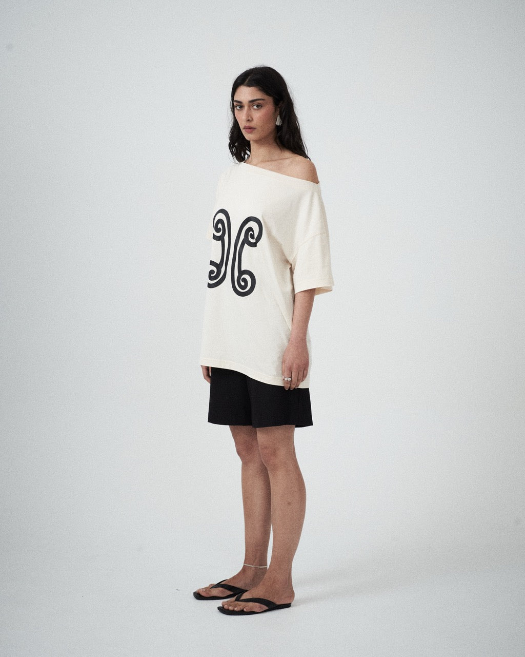 Three-quarter view of the Valencia Off-The-Shoulder Tee