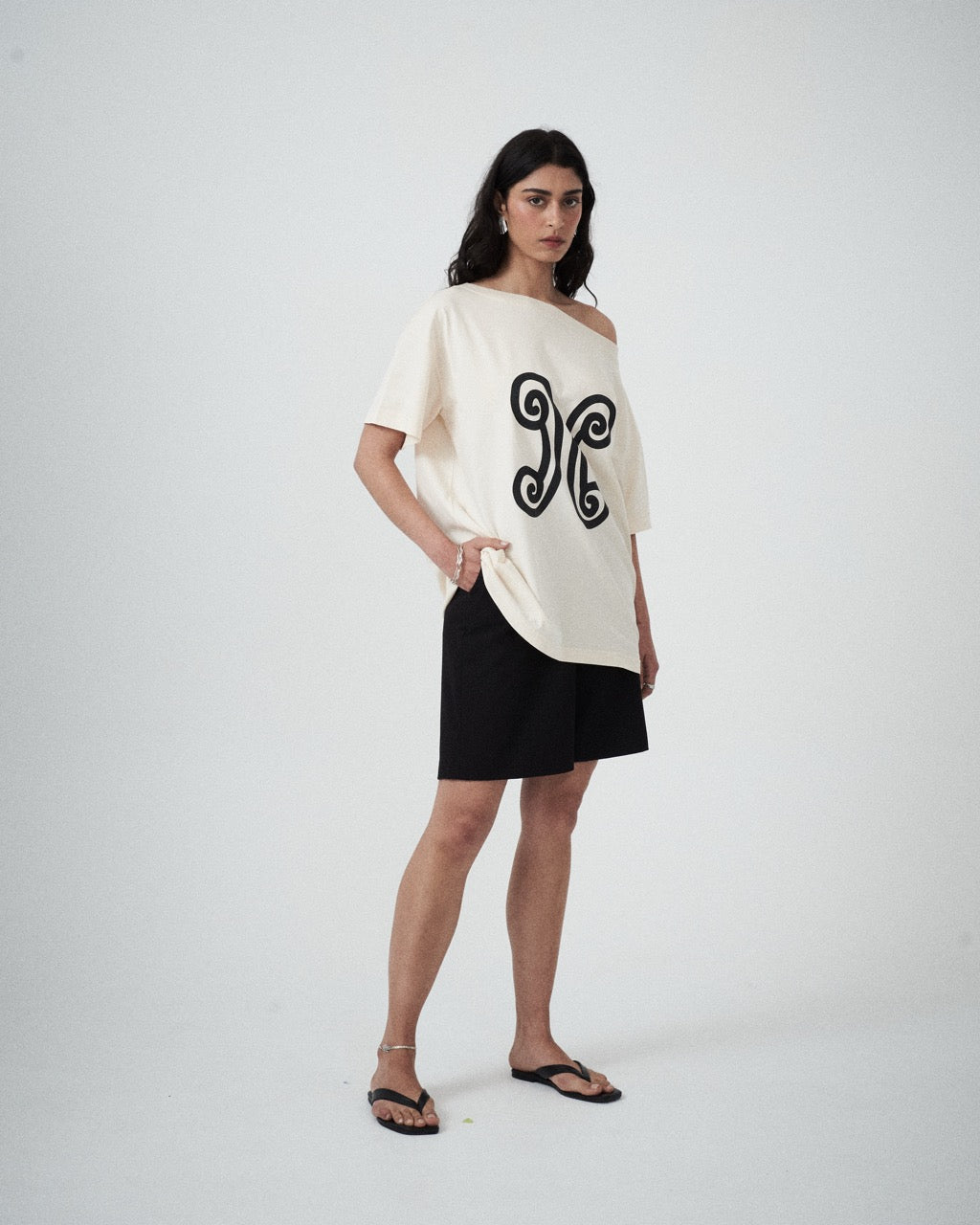 Three-quarter view of the Valencia Off-The-Shoulder Tee