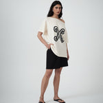 Three-quarter view of the Valencia Off-The-Shoulder Tee