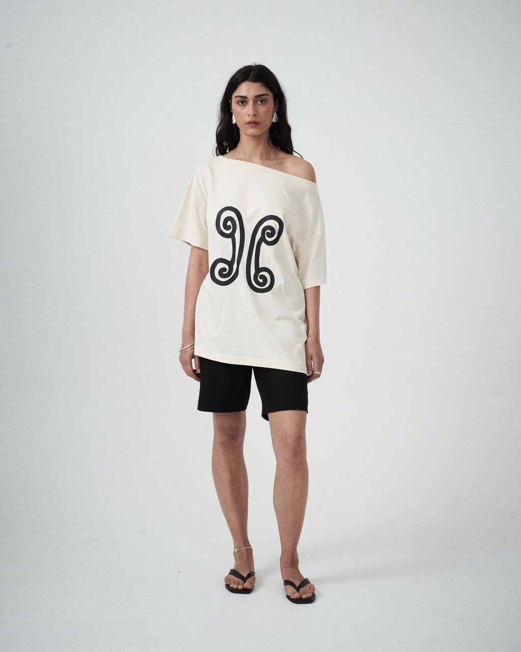 Model wearing the Valencia Off-The-Shoulder Tee in Milk, front view