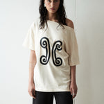 Mood shot featuring the Valencia Off-The-Shoulder Tee