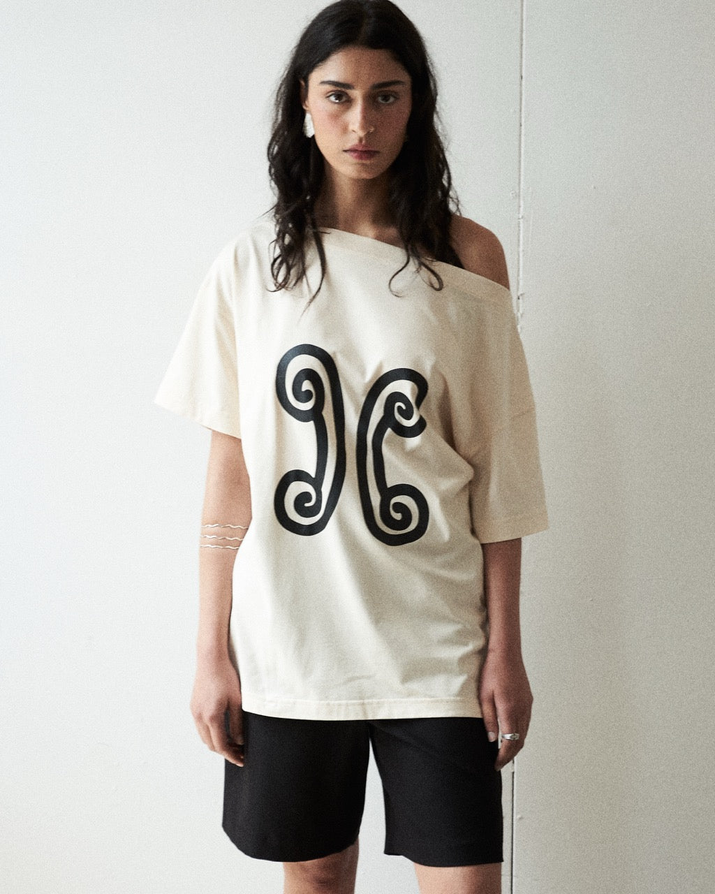 Mood shot featuring the Valencia Off-The-Shoulder Tee