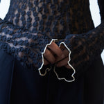 Close-up of VARNA Cecil Lace Top showing floral lace pattern and lettuce-edge detail.
