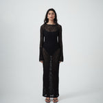Front view of VARNA Cecil Maxi Dress in black floral lace with semi-sheer design and scalloped detailing.