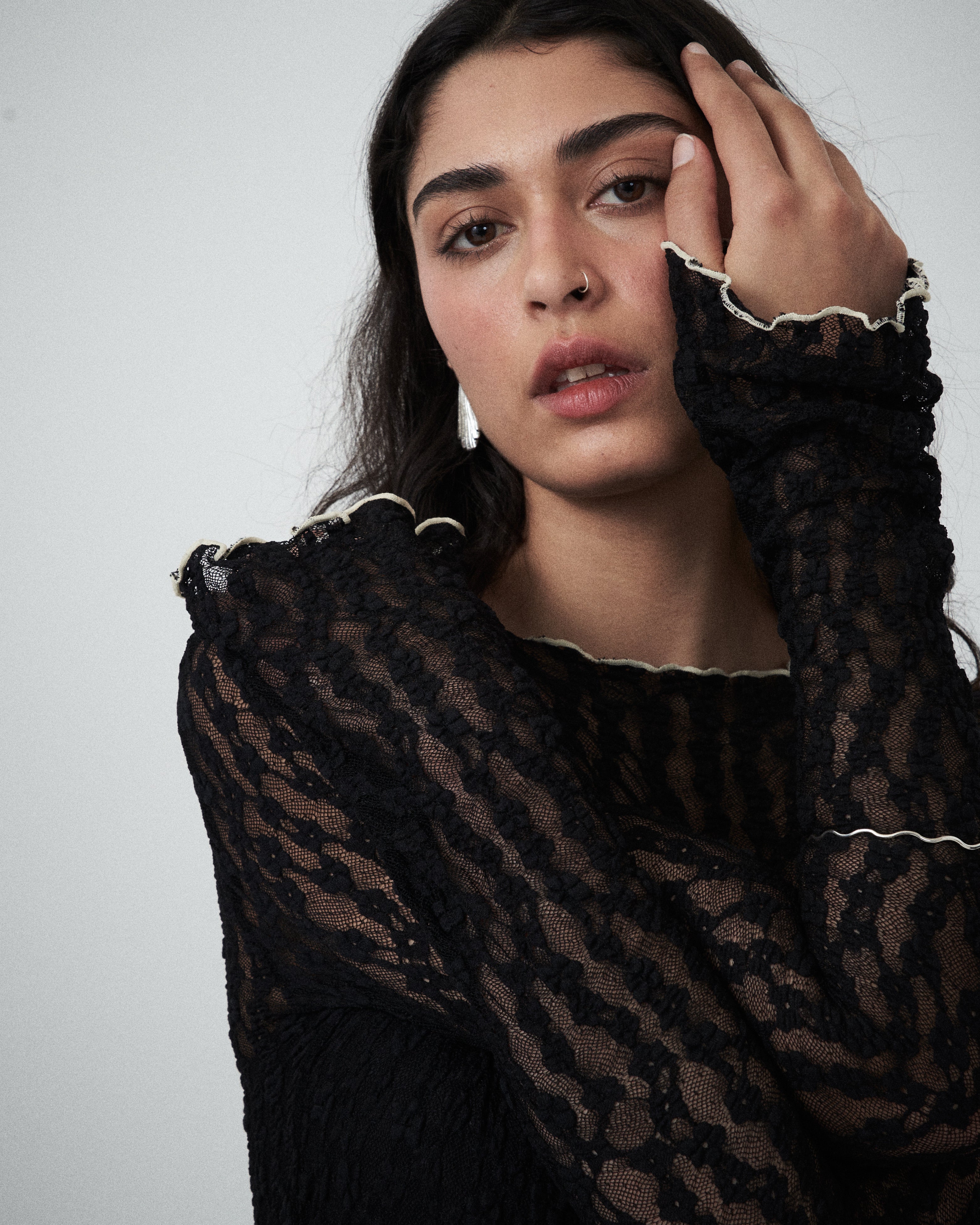 Close-up of VARNA Cecil Maxi Dress showing delicate black floral lace texture and trim detailing.