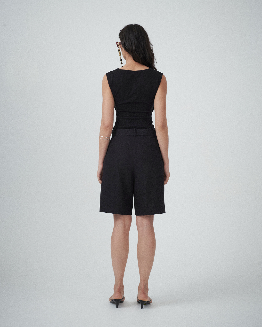 Back view of black tailored shorts