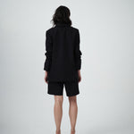 Back view of VARNA Erica Oversized Blazer in black featuring a relaxed fit and refined silhouette.