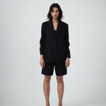 Front view of VARNA Erica Oversized Blazer in black showing relaxed tailored fit, single-breasted front, and tonal buttons.