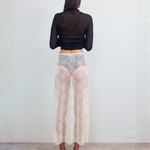 Back view of VARNA Lucienne Maxi Lace Skirt in milk floral lace highlighting sheer finish and fluid drape.