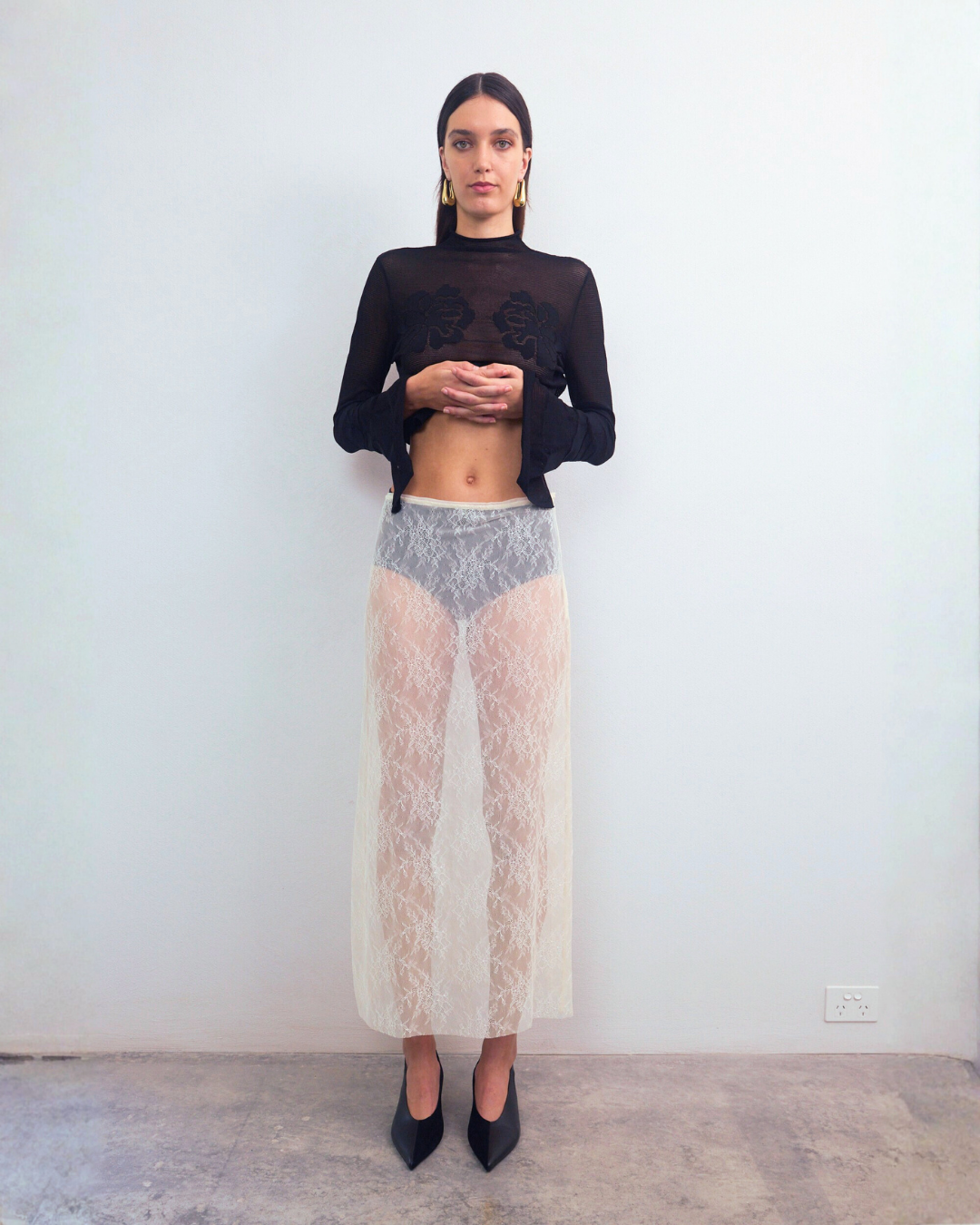 Front view of VARNA Lucienne Maxi Lace Skirt in milk — delicate floral lace texture with sheer style and straight silhouette.