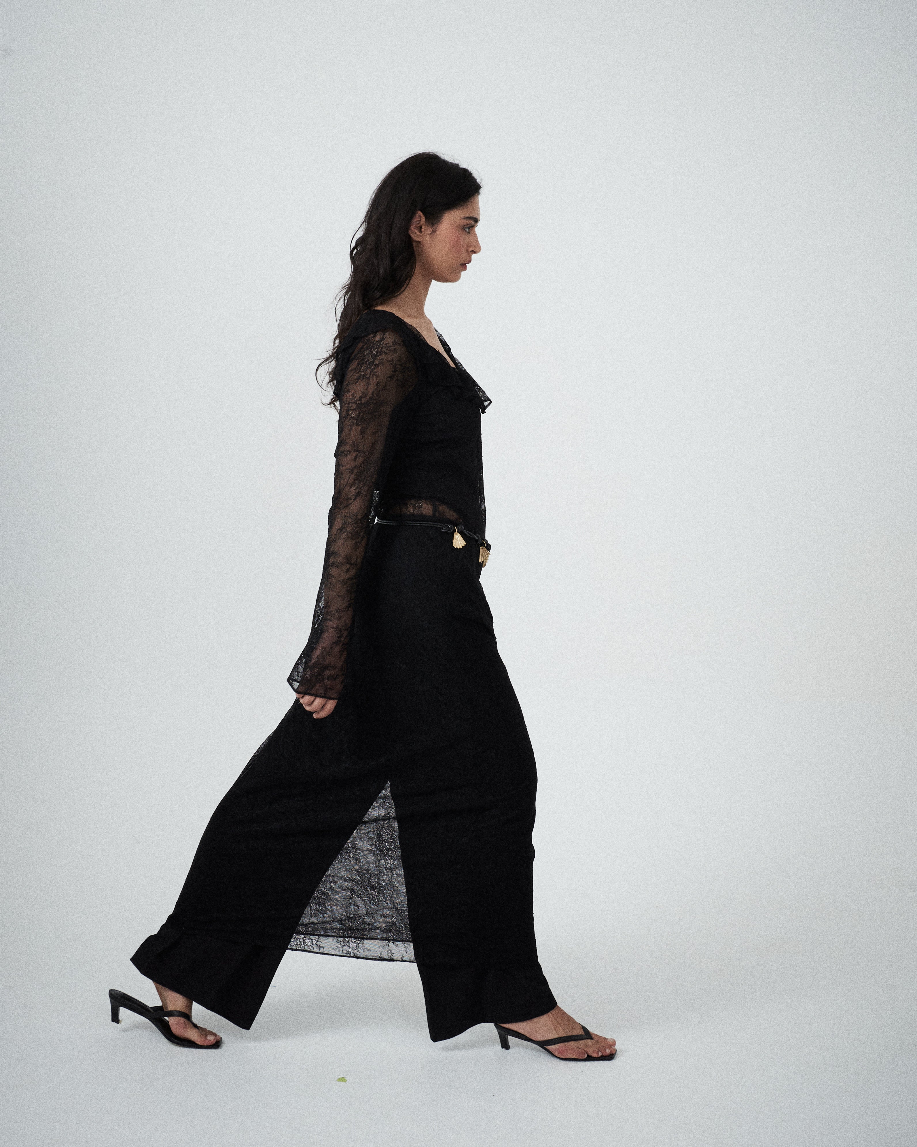 VARNA Lucienne Ruffle Lace Maxi Dress in black layered over Enrica Relaxed Tailored Pant — a modern contrast of lace and tailoring.