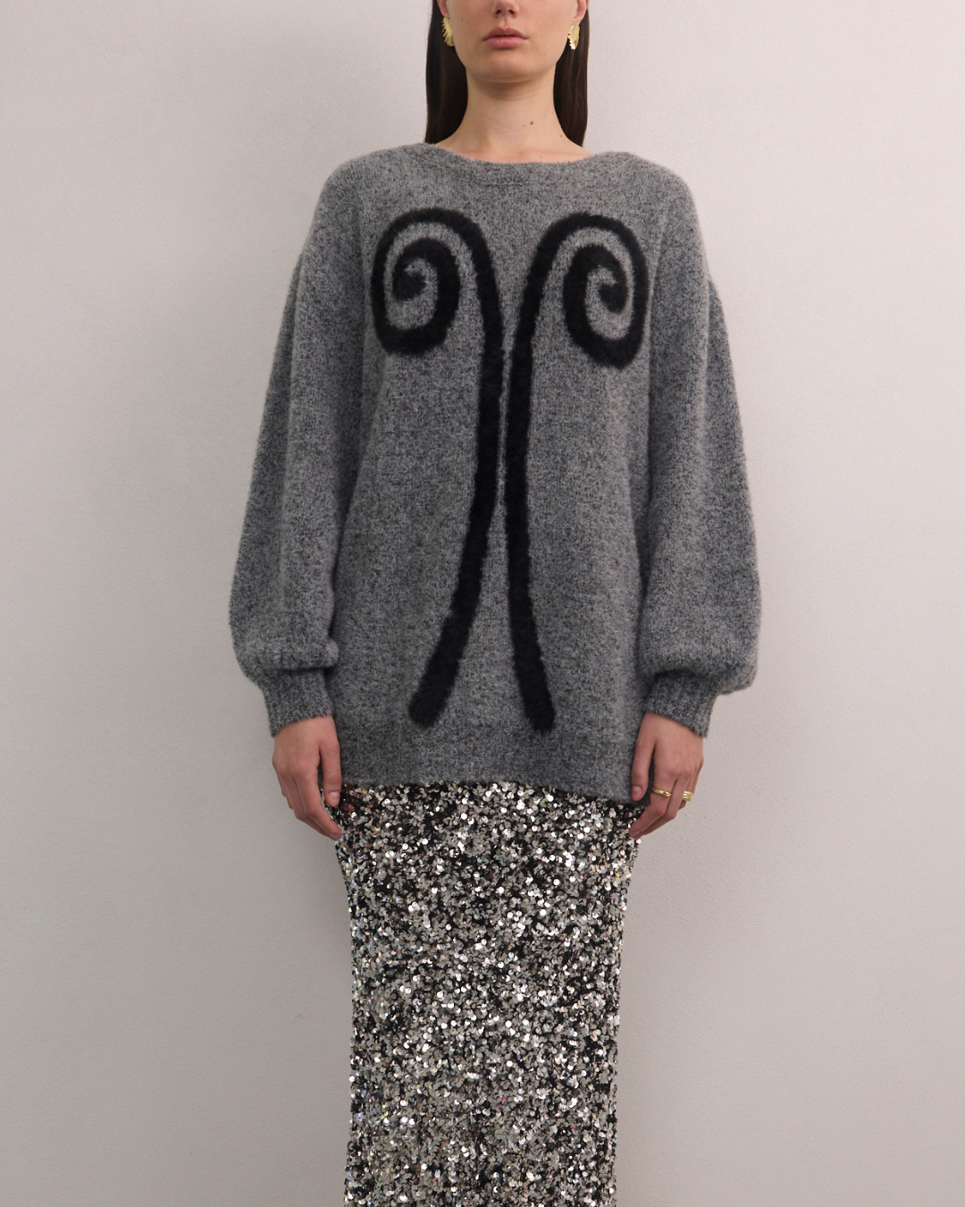 Front view of VARNA Maris Knit Top in charcoal alpaca-wool blend showing abstract motif and oversized silhouette.