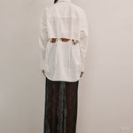 VARNA Rhea Tied Shirt in crisp white cotton with relaxed silhouette and cut-out waist detail.