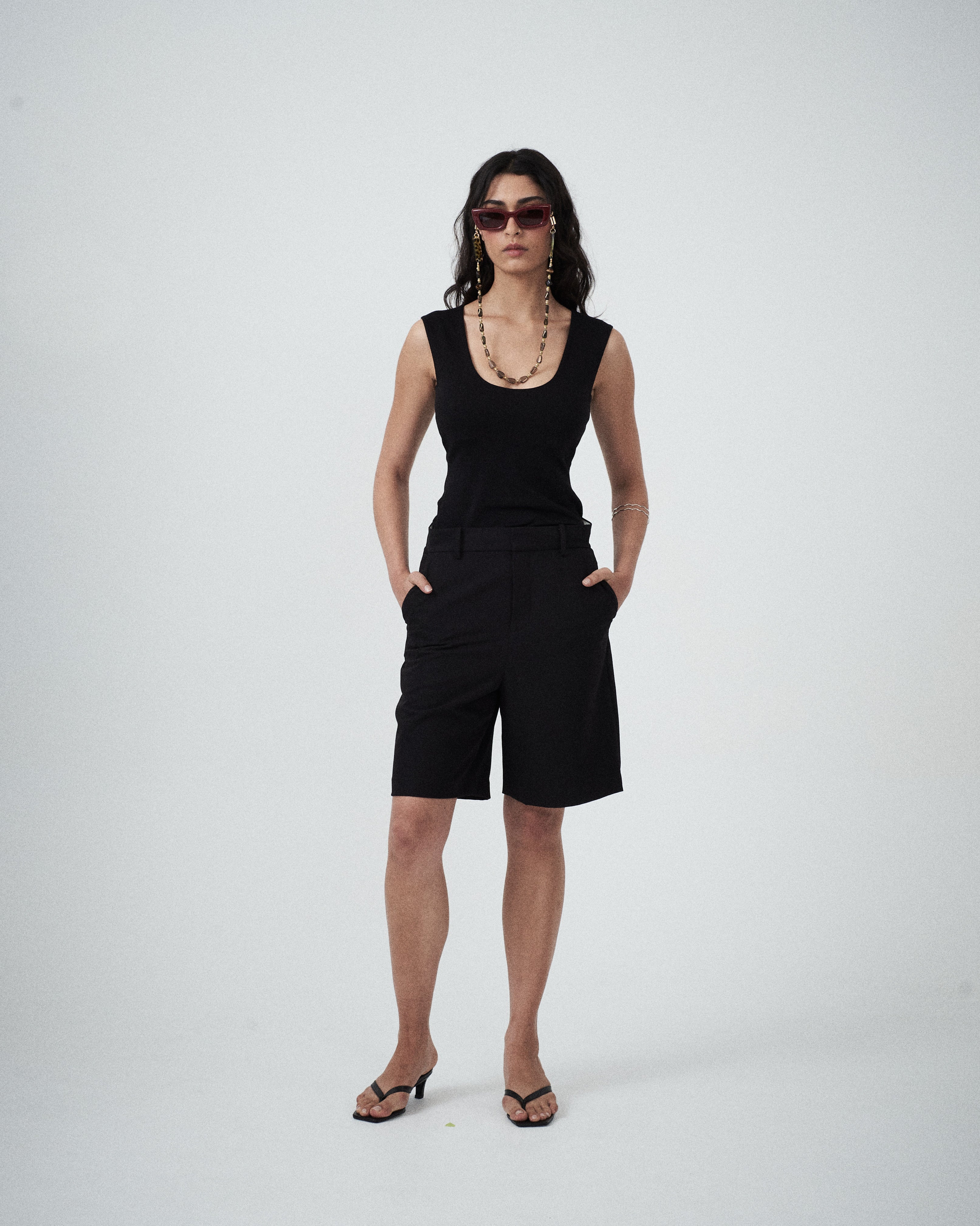 Black scoop-neck knit top with internal shelf bra