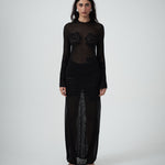 Close-up of VARNA Seraphine Knit Maxi Dress showing floral detail on sheer black knit.
