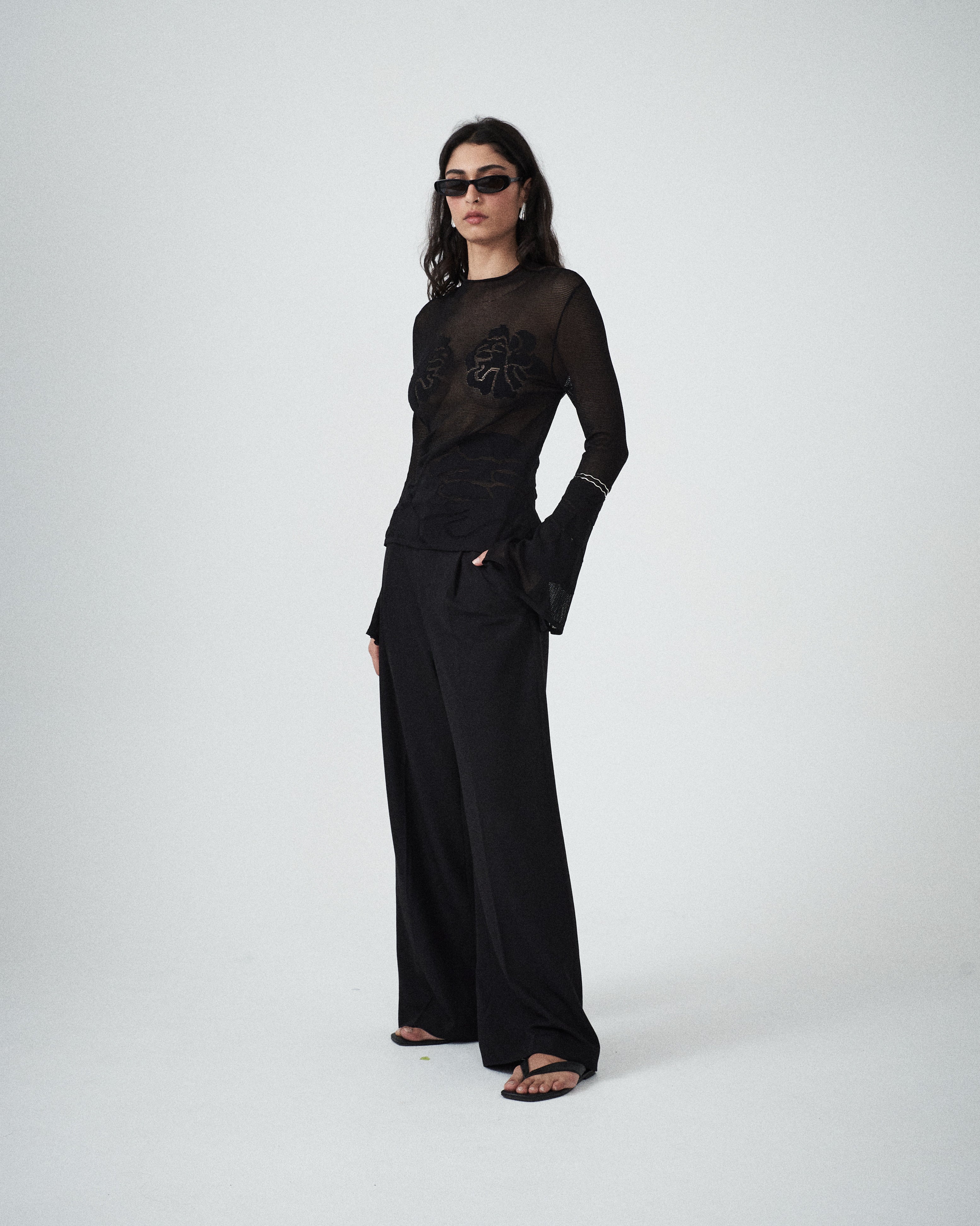 VARNA Seraphine Knit Top in black lightweight knit with high neckline and long sleeves.