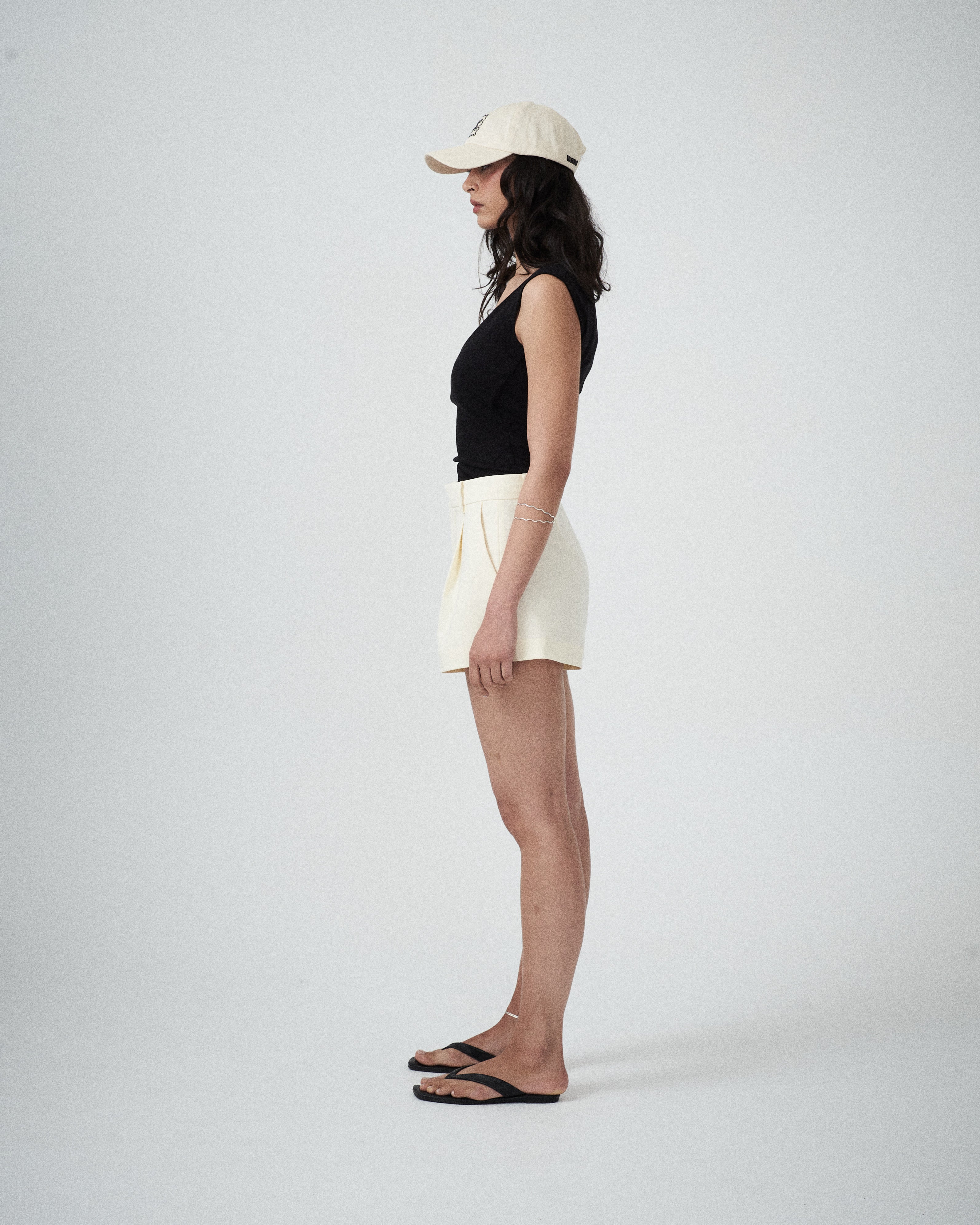 Close-up of VARNA Valencia Soft Cap showing tonal embroidery on cream drill fabric.