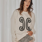 Ivory cotton designer sweater by VARNA, oversized fit styled with everyday essentials.