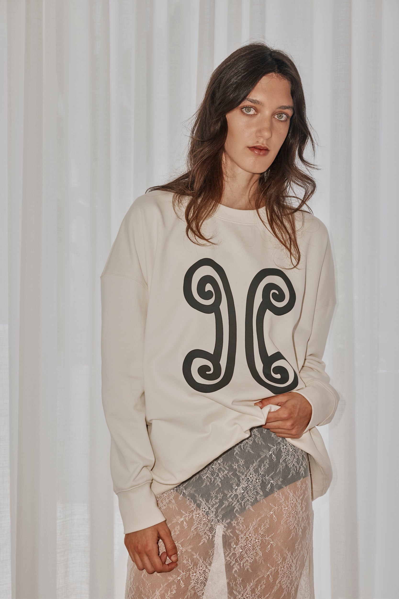 Ivory cotton designer sweater by VARNA, oversized fit styled with everyday essentials.