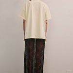 VARNA Valencia Tee in white cotton with relaxed unisex fit and dropped shoulders.