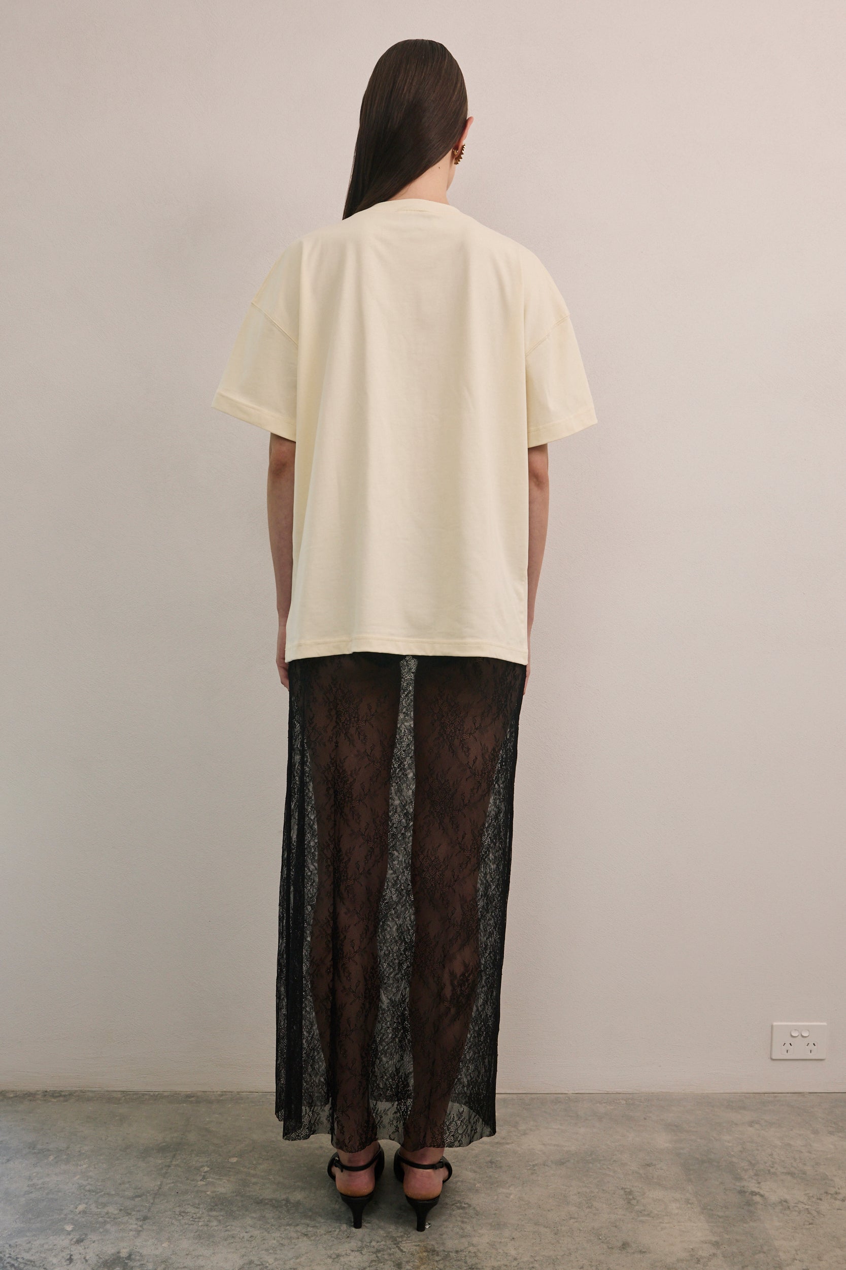 VARNA Valencia Tee in white cotton with relaxed unisex fit and dropped shoulders.