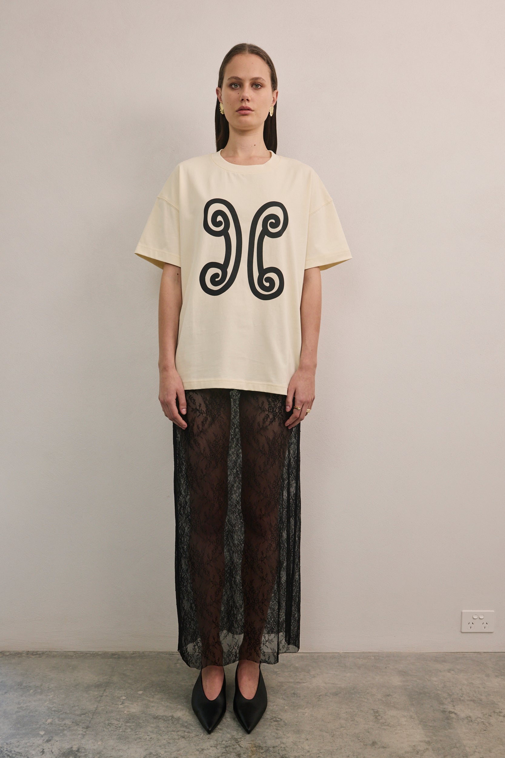 VARNA Valencia Tee in white cotton with relaxed unisex fit and dropped shoulders.